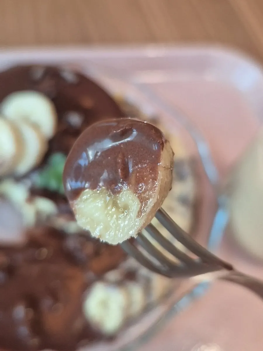 Banana topped with thinly sliced chocolate chips