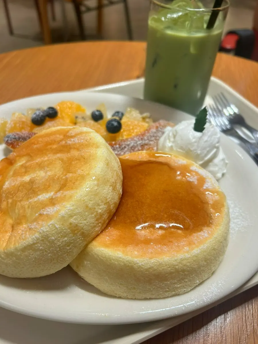 A plate of Petrico's fruit soufflé topped with seasonal fruit