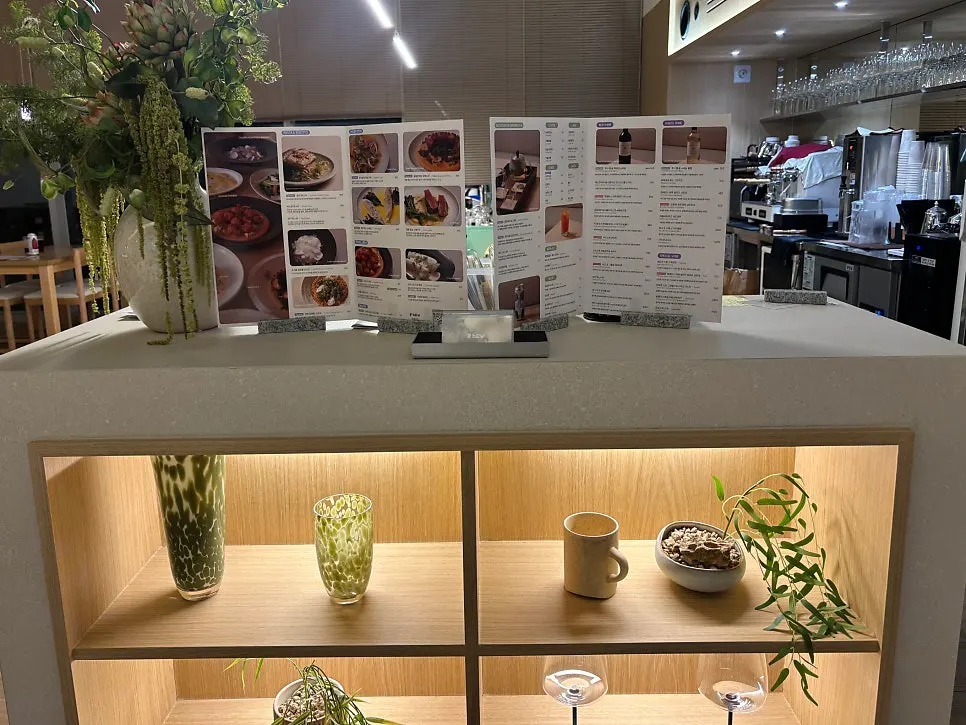 A Pyu Euljiro table with soft lighting and generous spacing