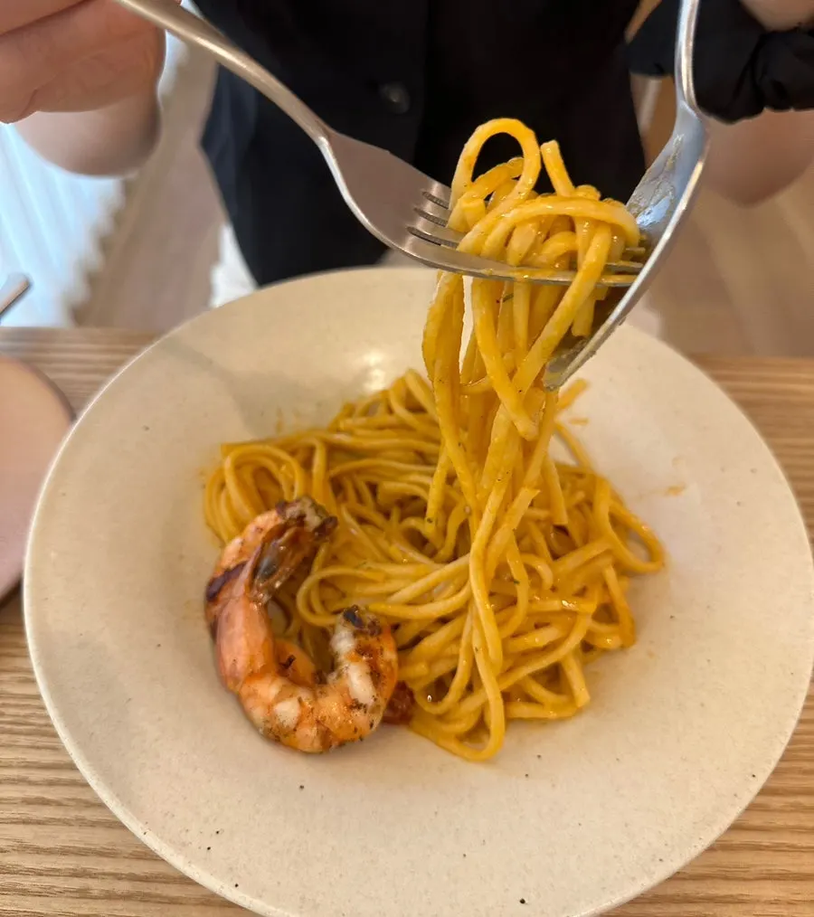 Noodles of the bisque pasta coated in sauce
