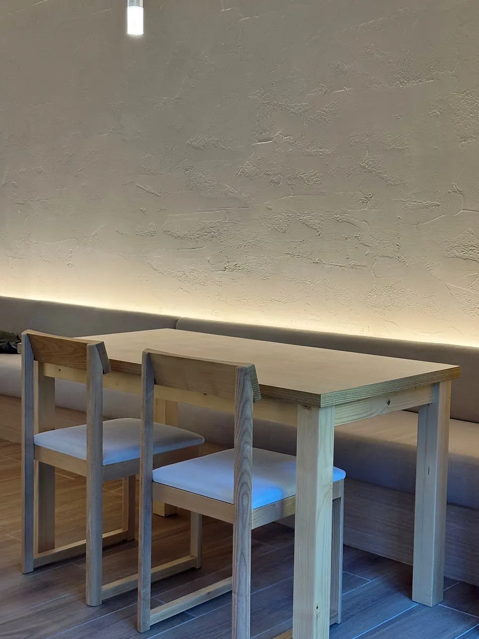 Table at Pyu Euljiro lit with warm-toned lighting