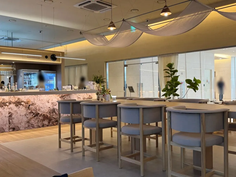 Wall-mounted glass display case with plants