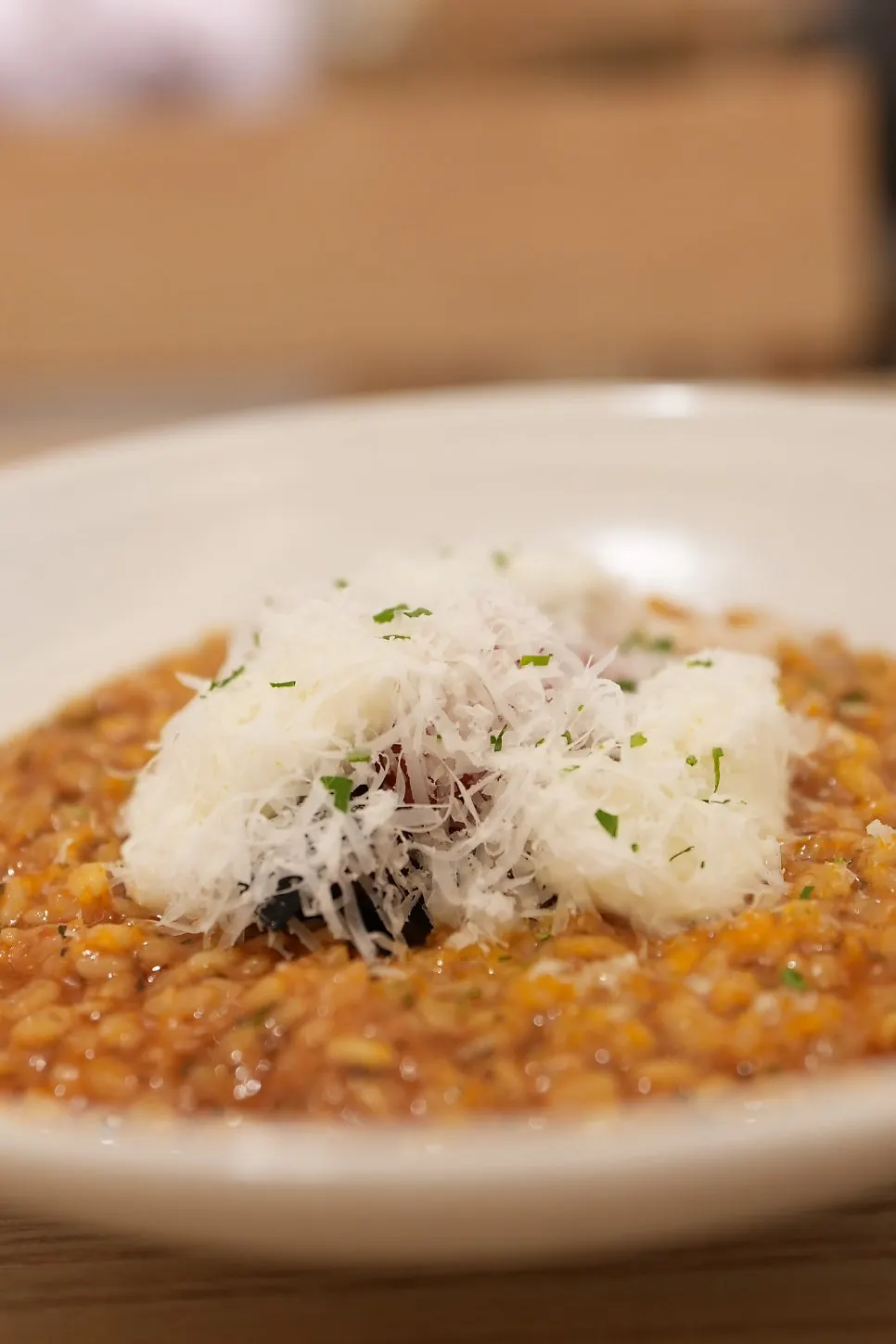 A bite of ragu pasta paired with the craft beer