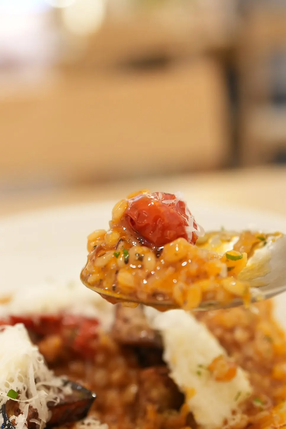 Close-up of garden tomato risotto showing the rice texture