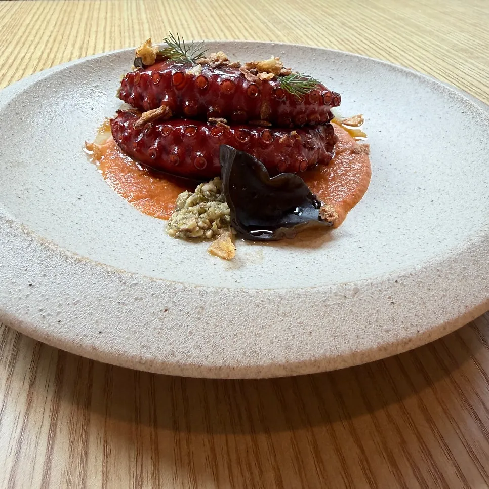 Charcoal octopus with romesco sauce at Pyu Euljiro