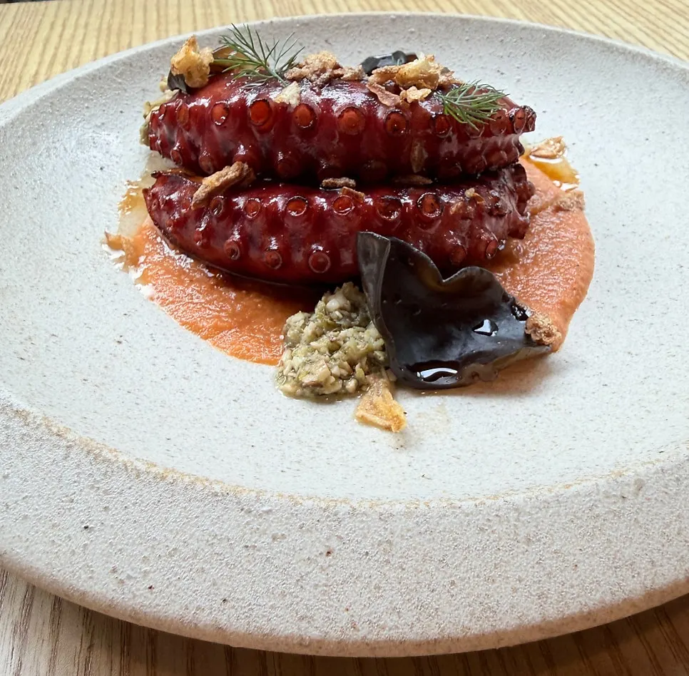 Charcoal octopus served with romesco sauce
