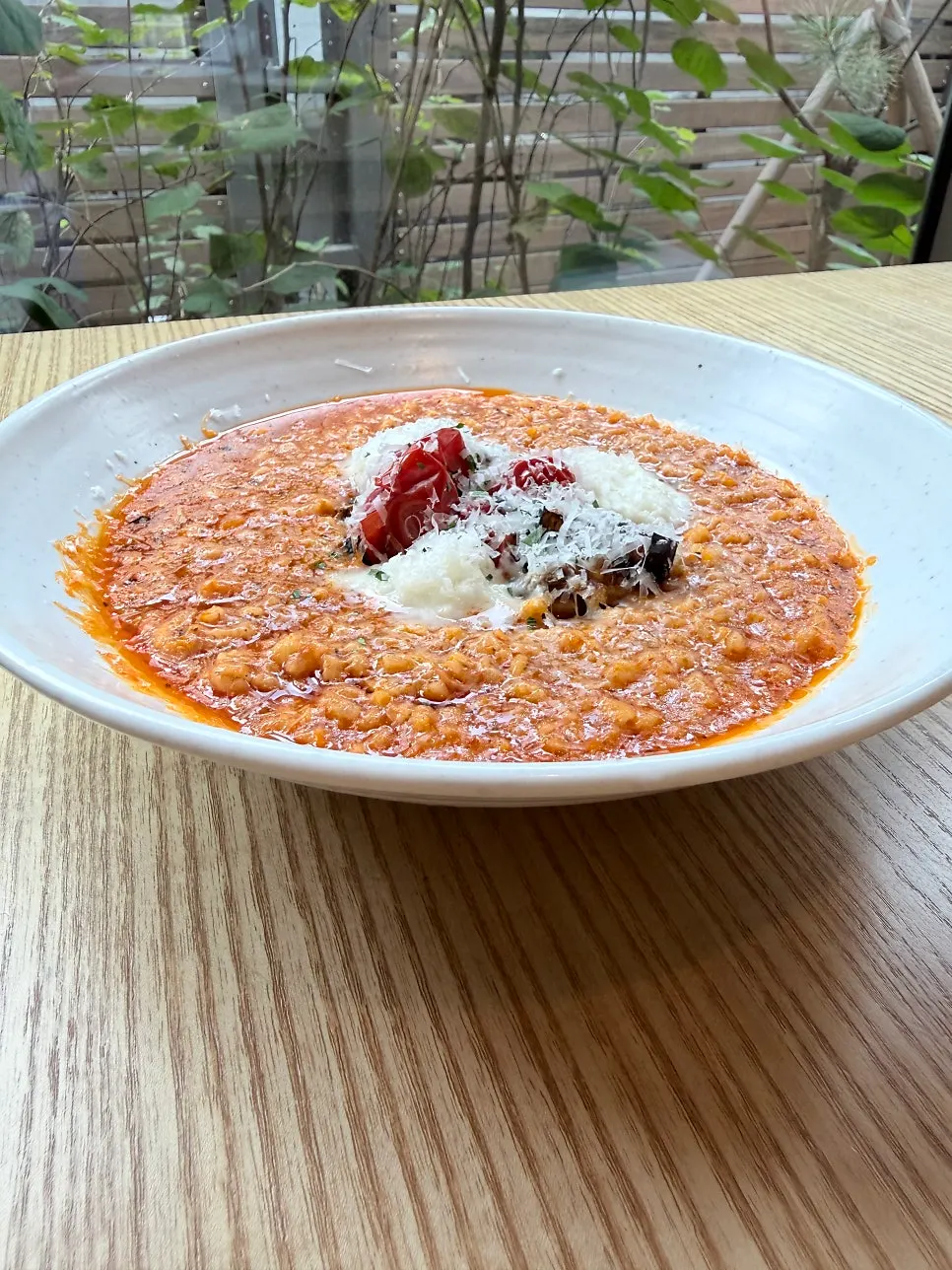 Garden tomato risotto topped with roasted vegetables