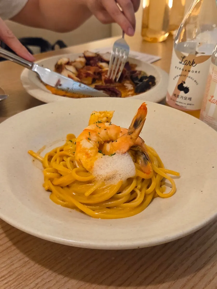 Pyu Euljiro's bisque pasta topped with shrimp