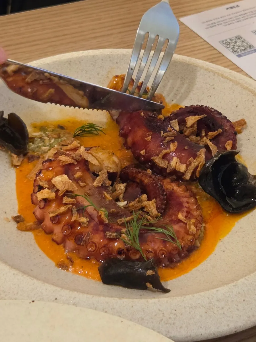 A plate of plump charcoal-grilled octopus legs