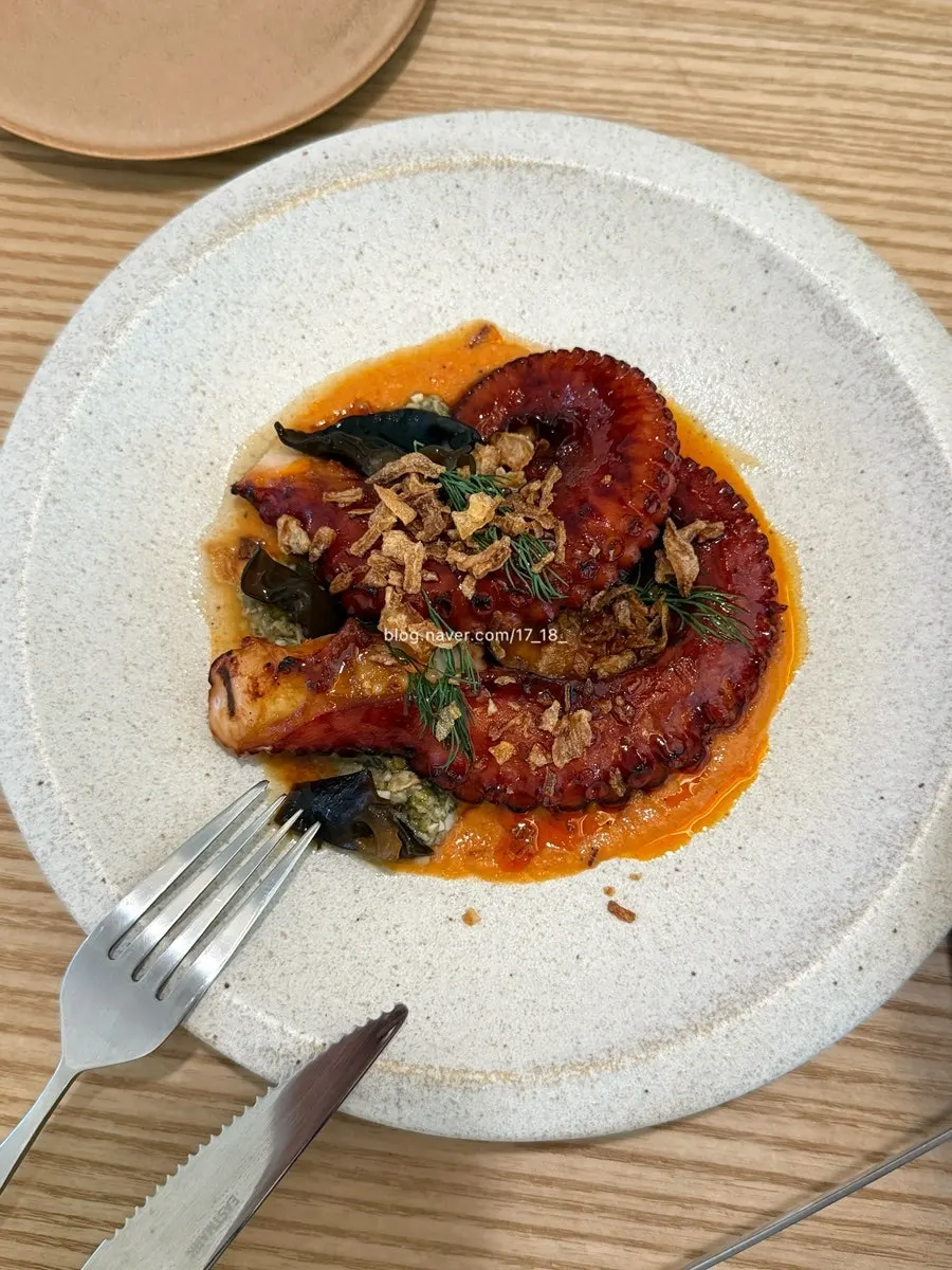 Tomato and cheese on top of barley risotto