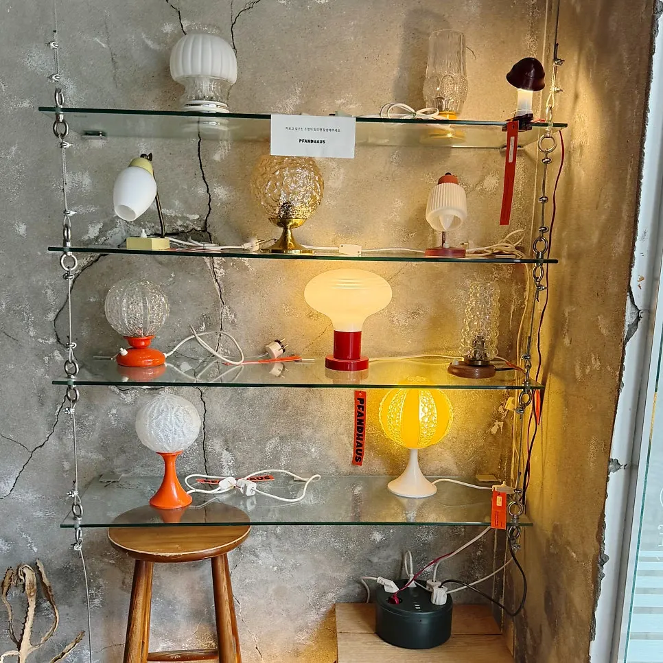 A vintage lamp sales corner with mismatched shapes