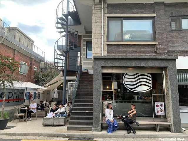 Pip Espresso Bar's outdoor tables and benches full of customers