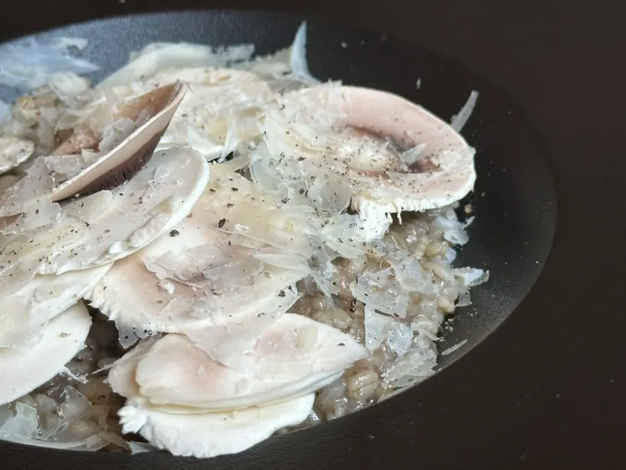 Truffle risotto topped with fresh mushrooms