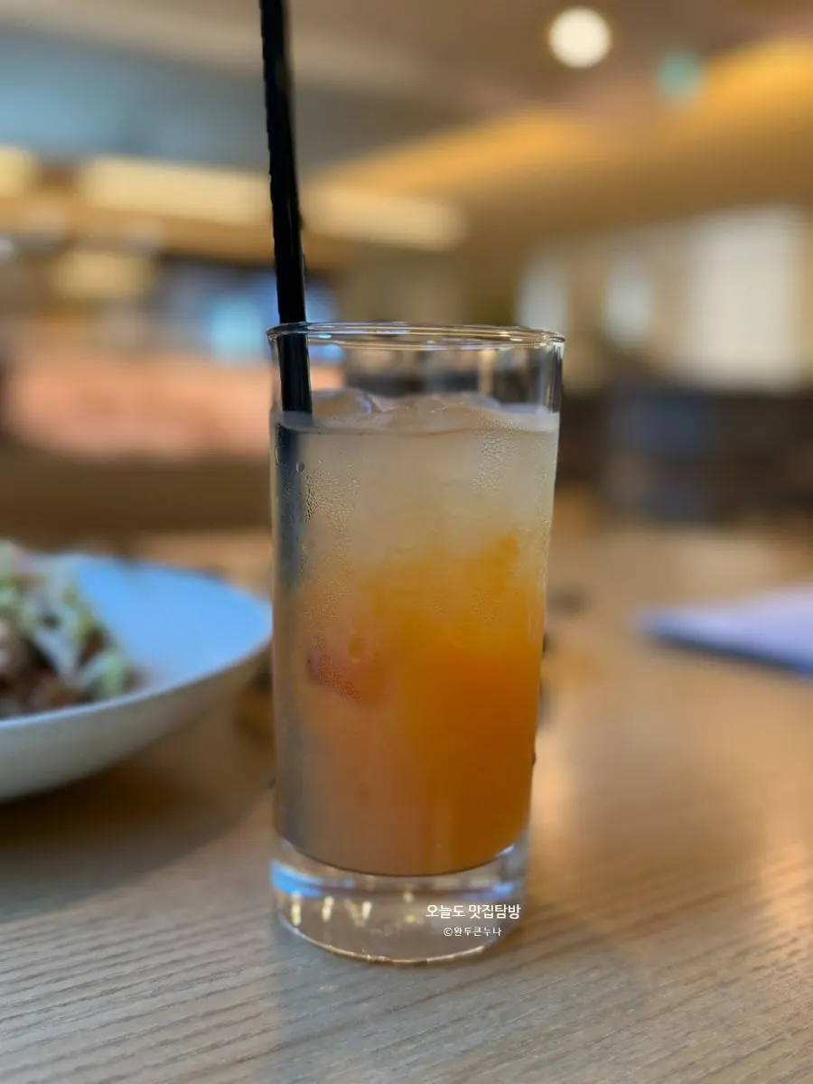 Two glasses of apple carrot juice and grapefruit juice