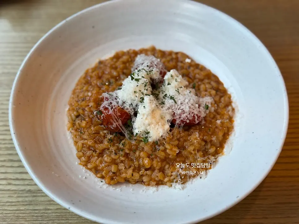 Garden tomato risotto topped with roasted vegetables