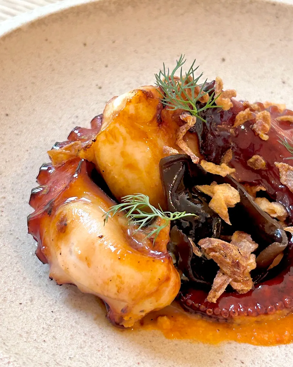 Charcoal-grilled octopus dish with two large legs
