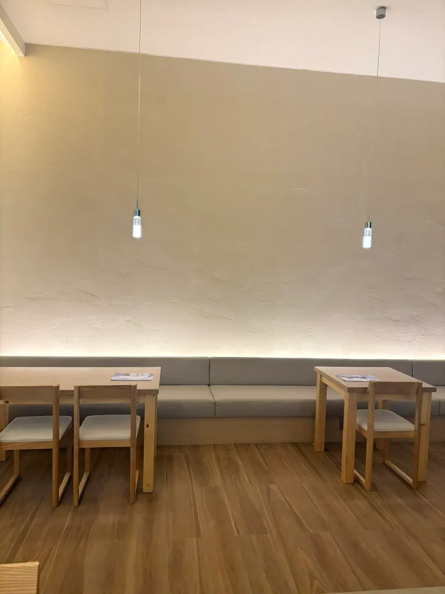 Corridor on the right leading to private rooms