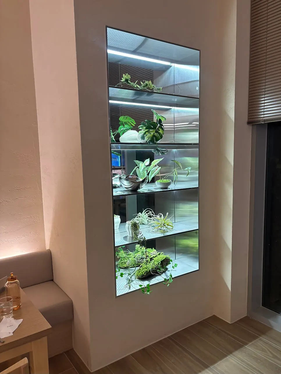Corner of the restaurant with green plants