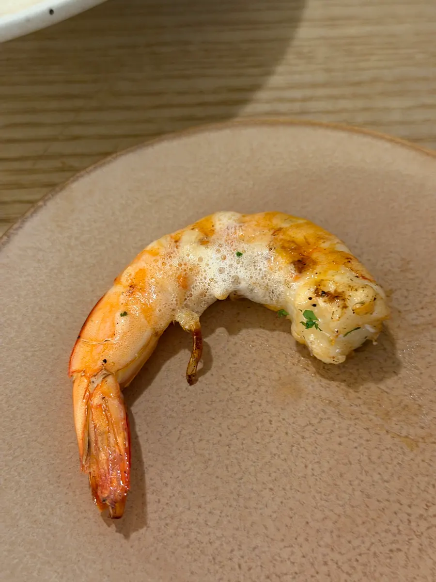 Whole shrimp on top of the bisque pasta
