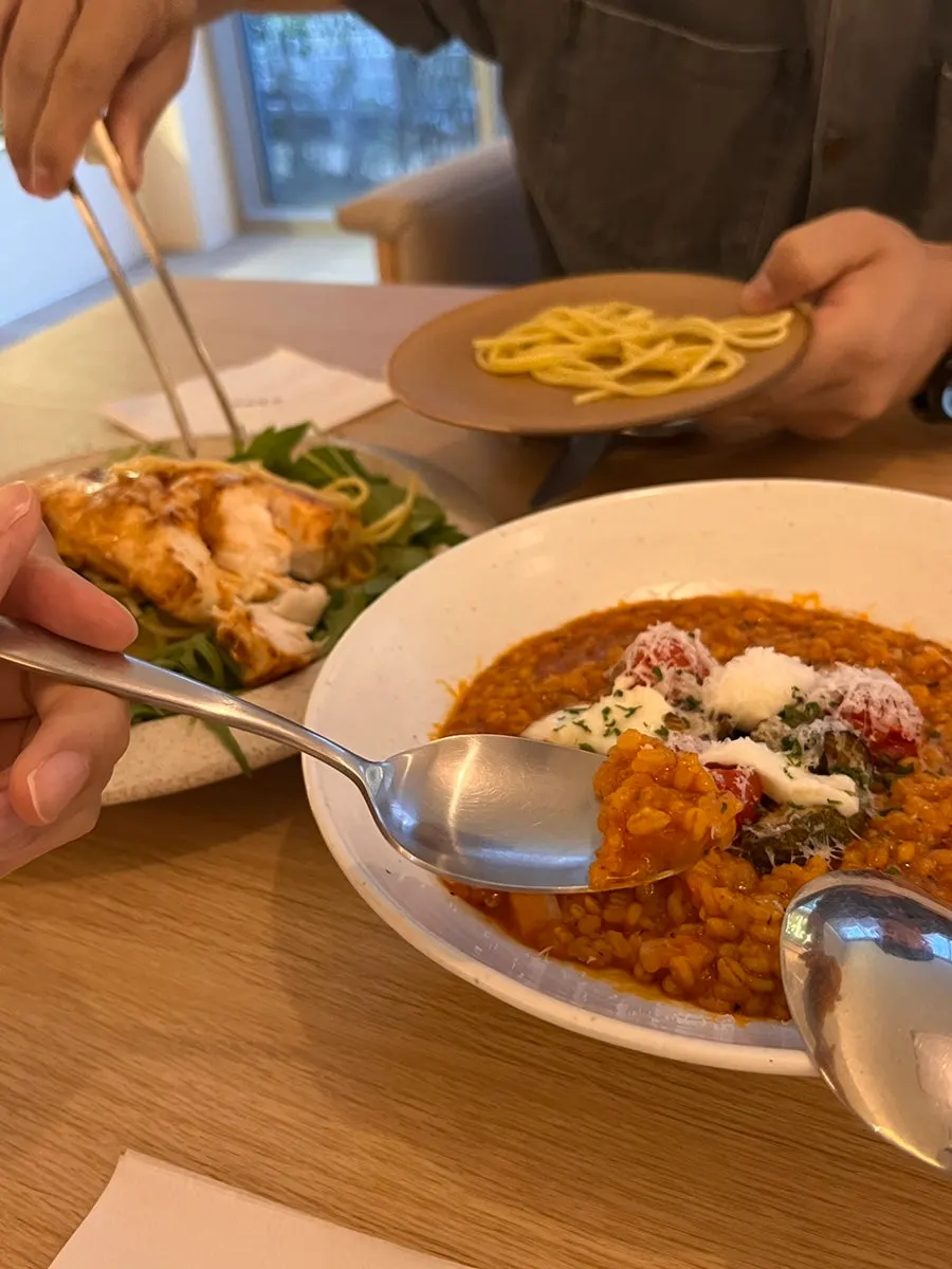 Garden tomato risotto topped with grilled vegetables and mozzarella