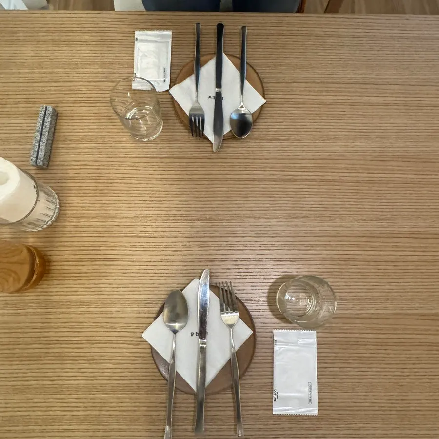 Table setting at Pyu Euljiro with a reserved-guest name card