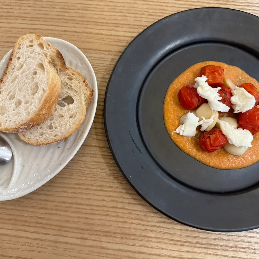 Smoked tomato with roasted cherry tomatoes, cheese, and sauce