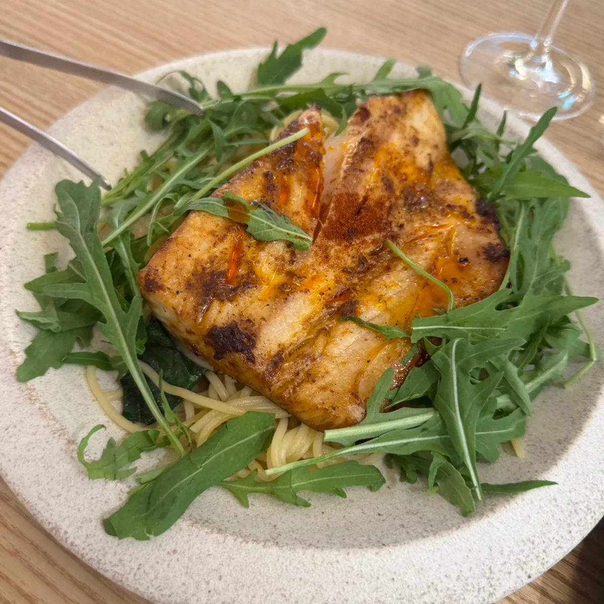 Mackerel pasta topped with rocket and grilled mackerel