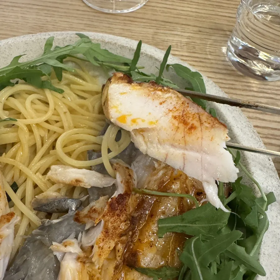A large piece of thick, grilled mackerel