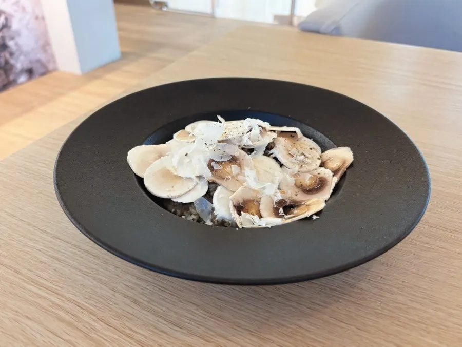 Cross-section of charcoal octopus with romesco sauce