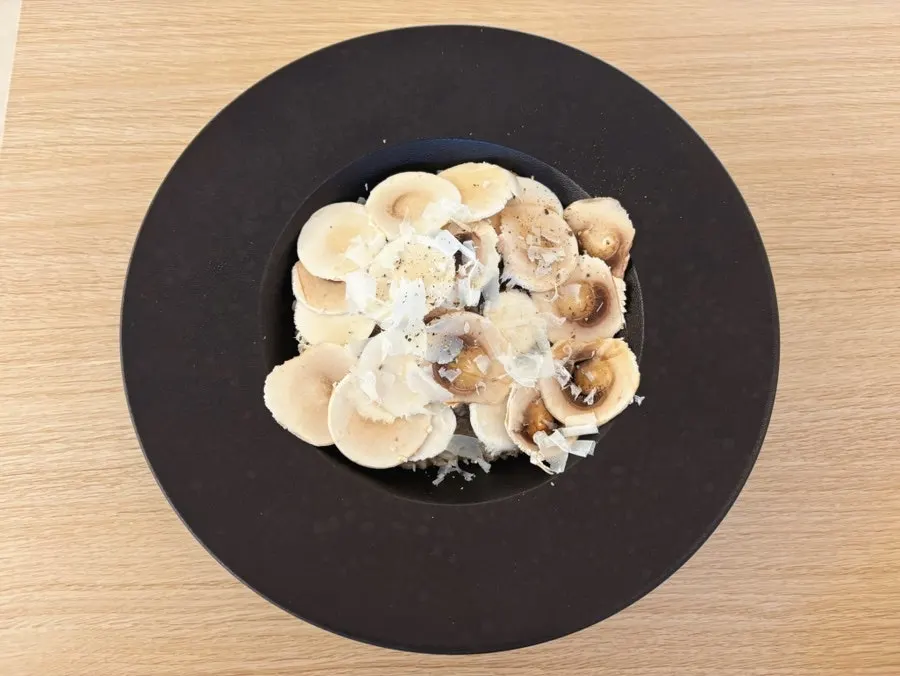 Plate of charcoal octopus wiped clean of sauce