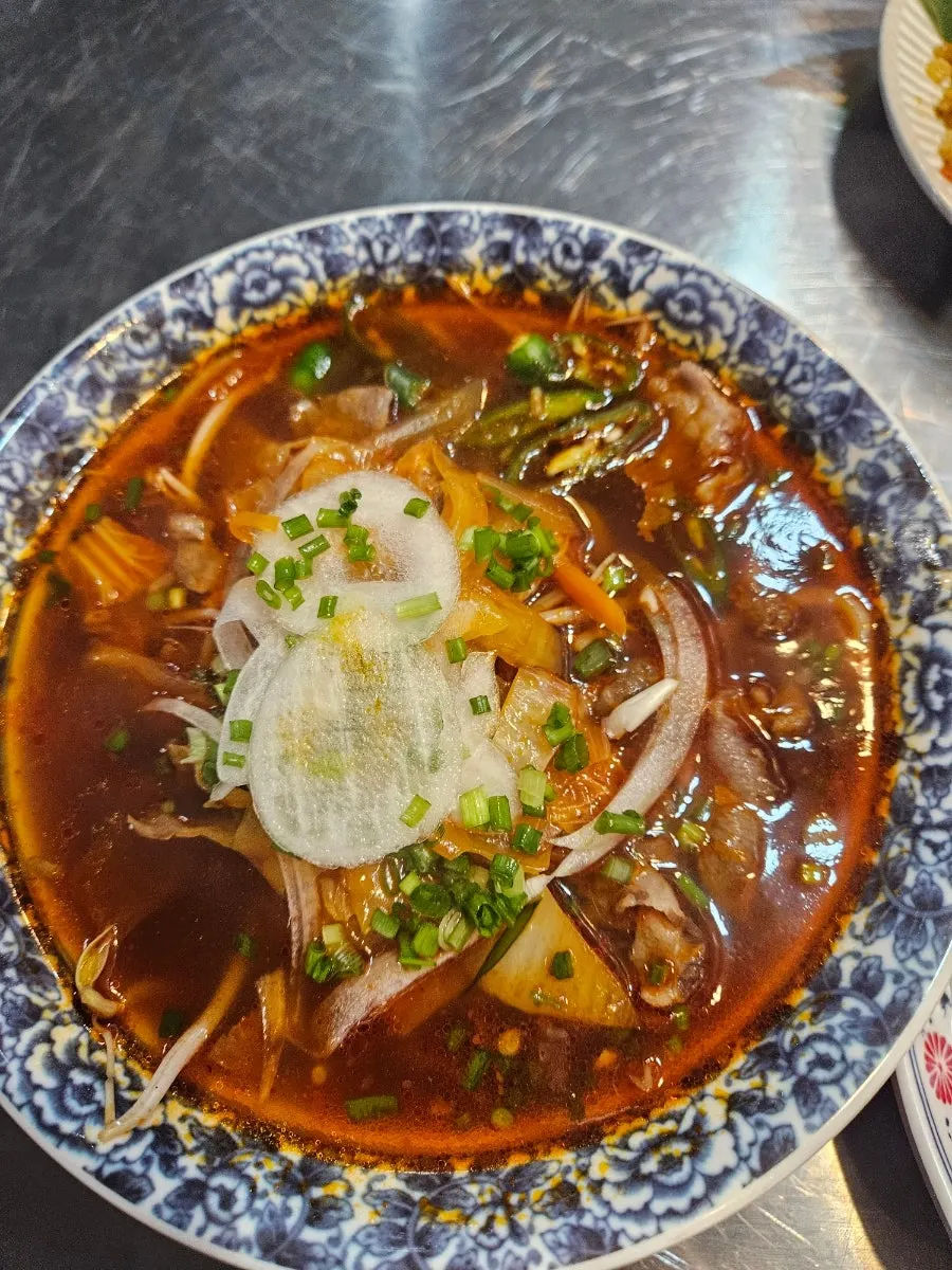 Pickled radish, pickled onion, chili sauce, and hoisin sauce