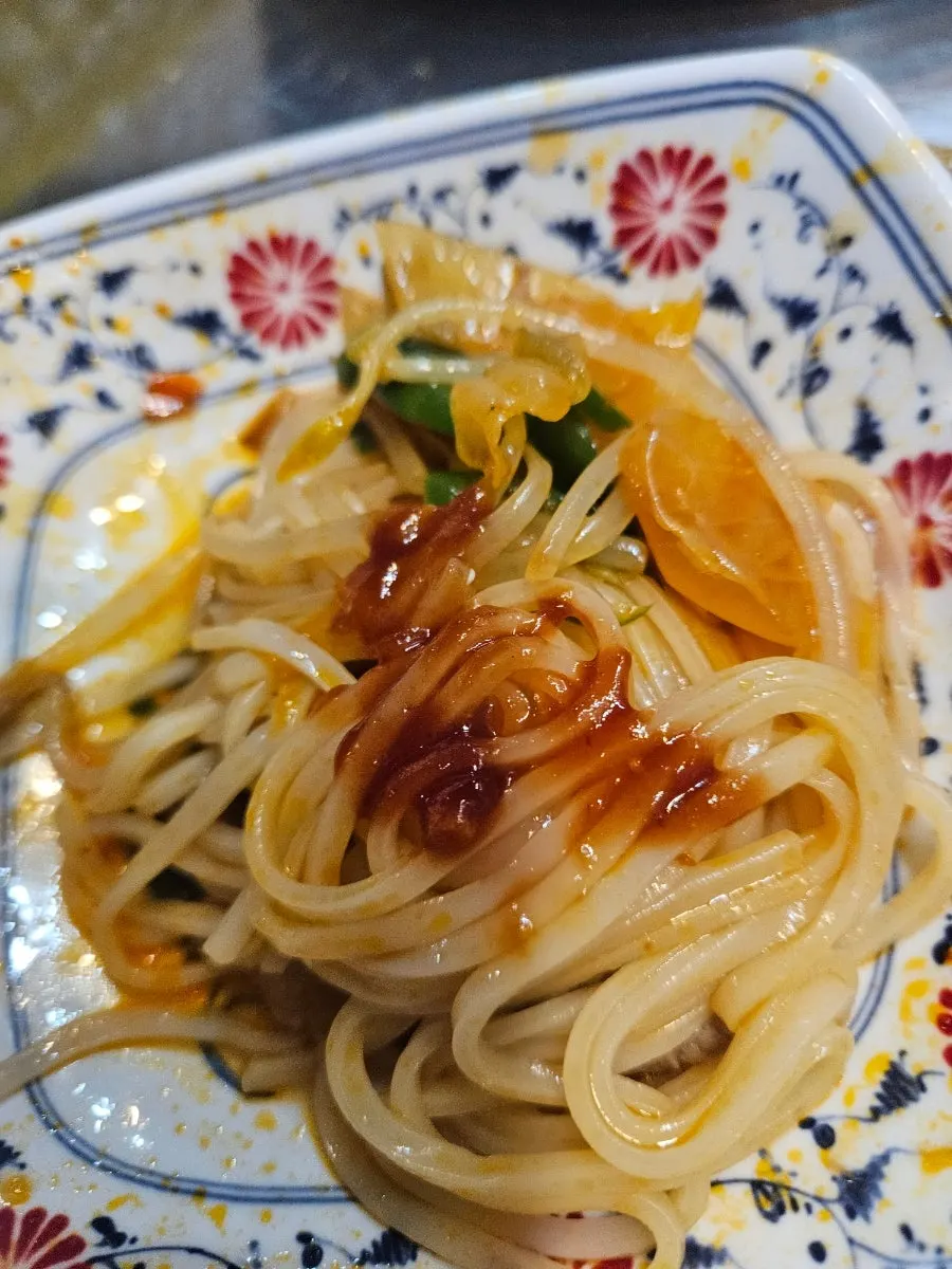 Spicy pho loaded with bean sprouts and meat