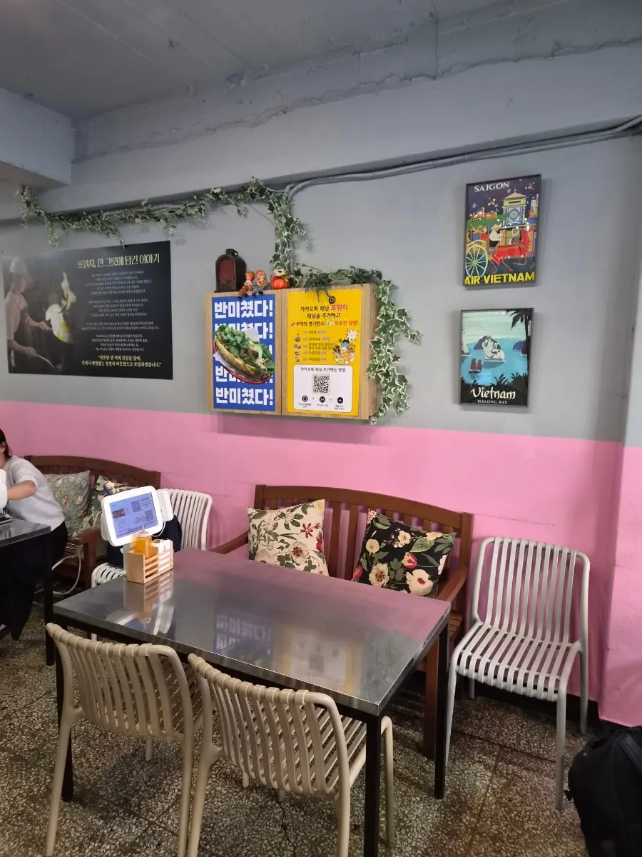Wall at Pho Witch decorated with Vietnamese-themed posters