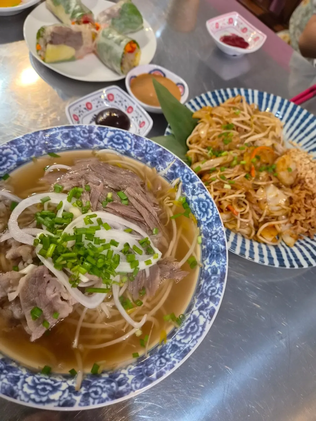 Stir-fried pho topped with crushed peanuts at Pho Witch