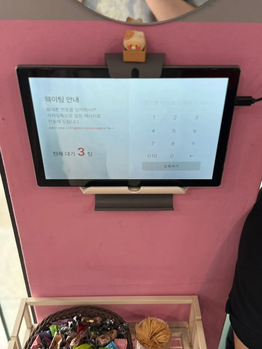 Tablet inside the store for registering a wait