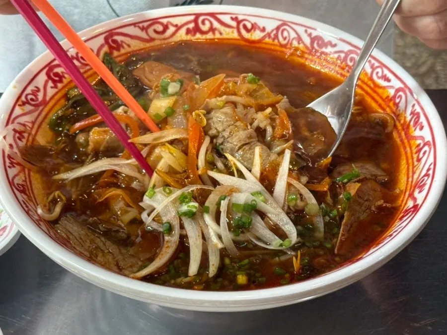Spicy pho topped with half brisket, half beef short rib