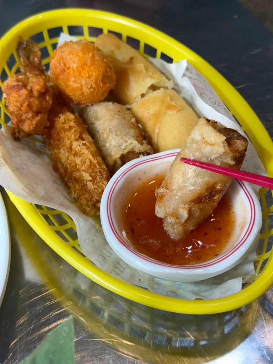 Close-up of seafood cha gio and king shrimp tempura among the mixed fritters