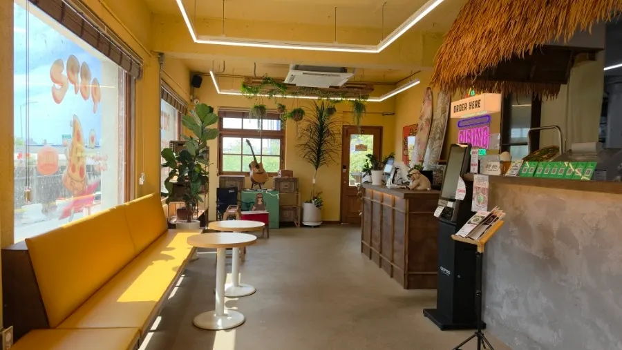 1st floor interior of Pibing Paldang Branch with wood tones and yellow light