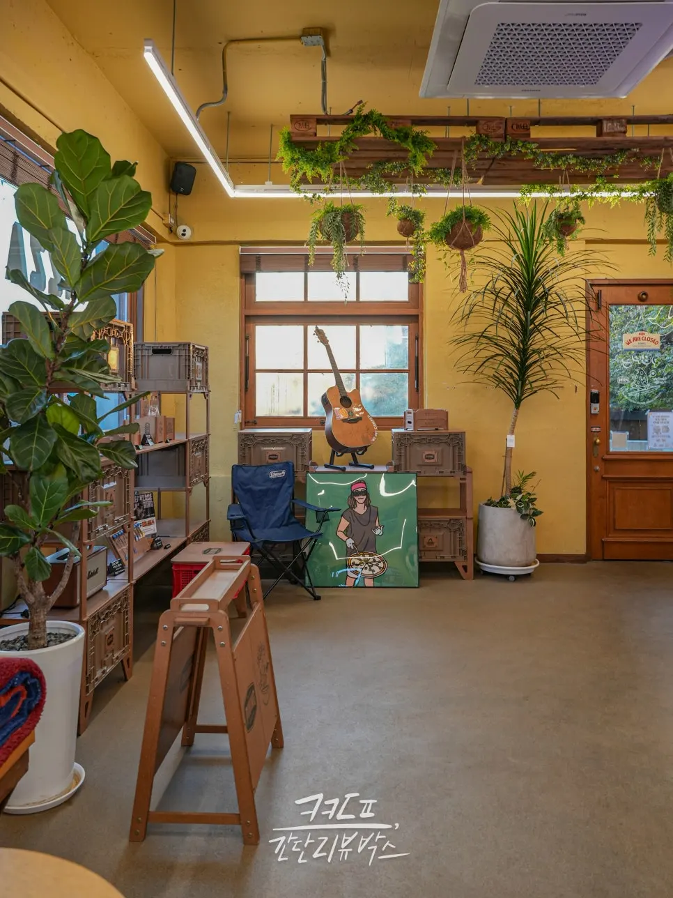 1st floor space with a surfboard and items for sale