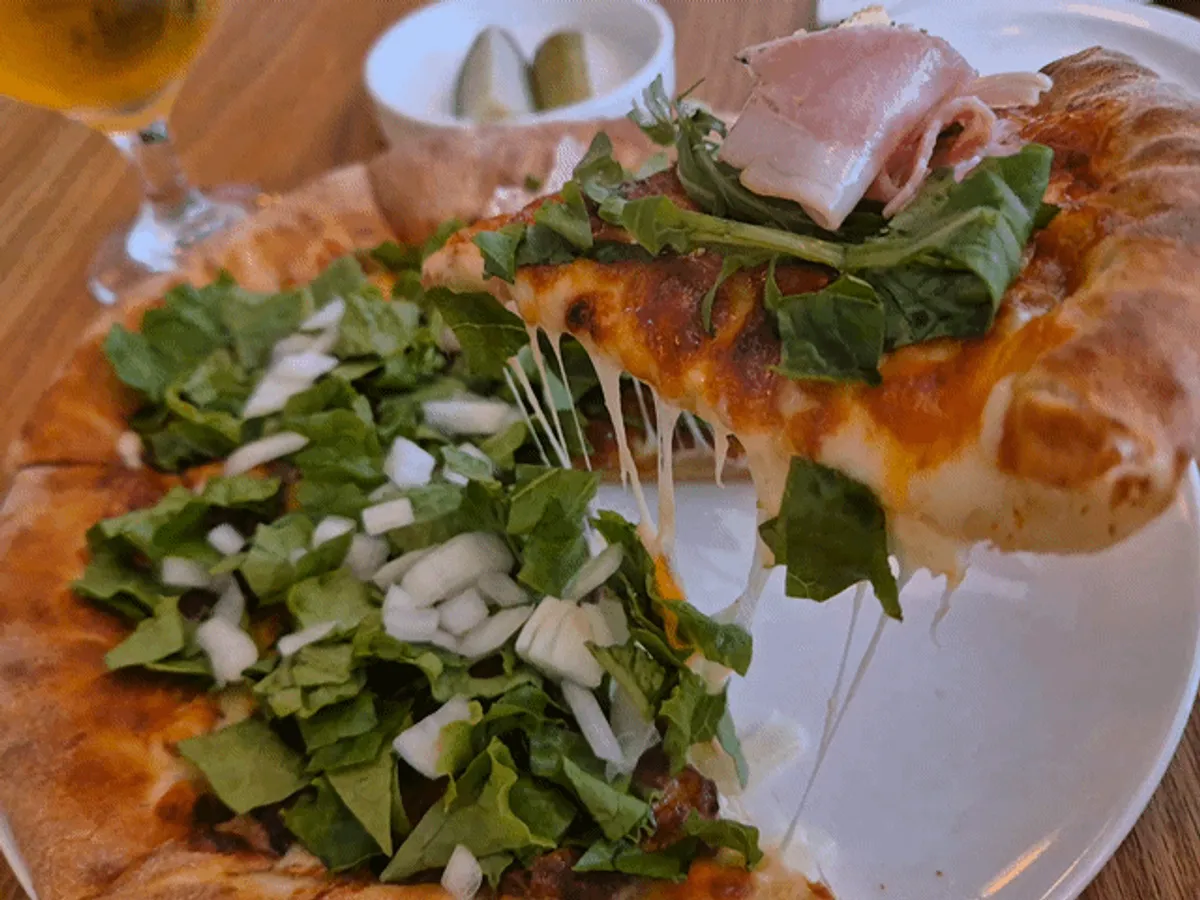 Close-up of the half-and-half pizza with added cheese crust