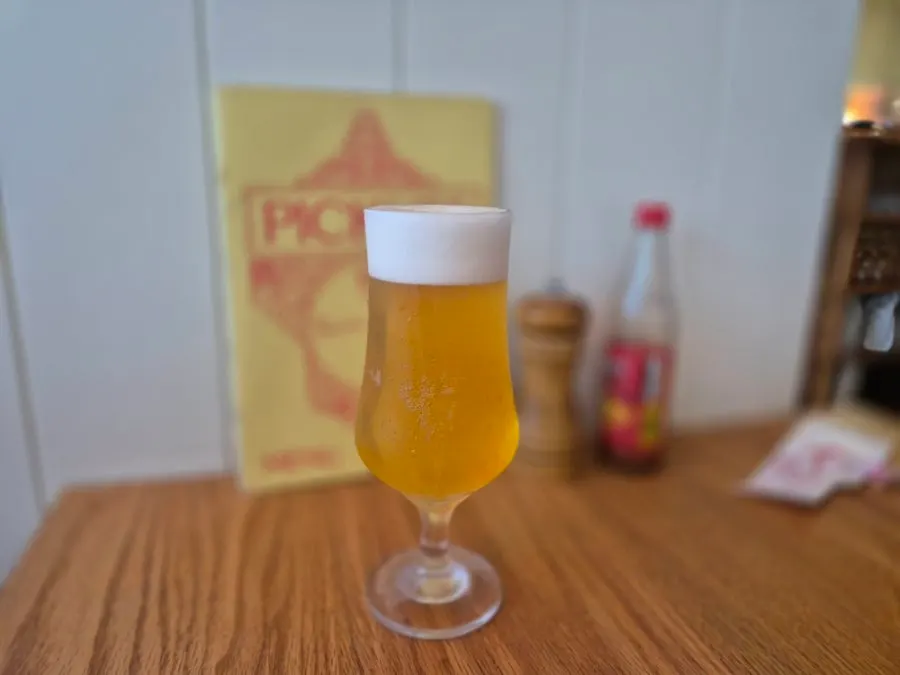 Two glasses of beer ordered alongside the half-and-half pizza