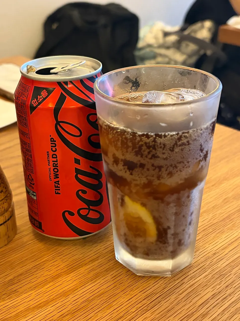 Cola served with a lemon-slice ice cup