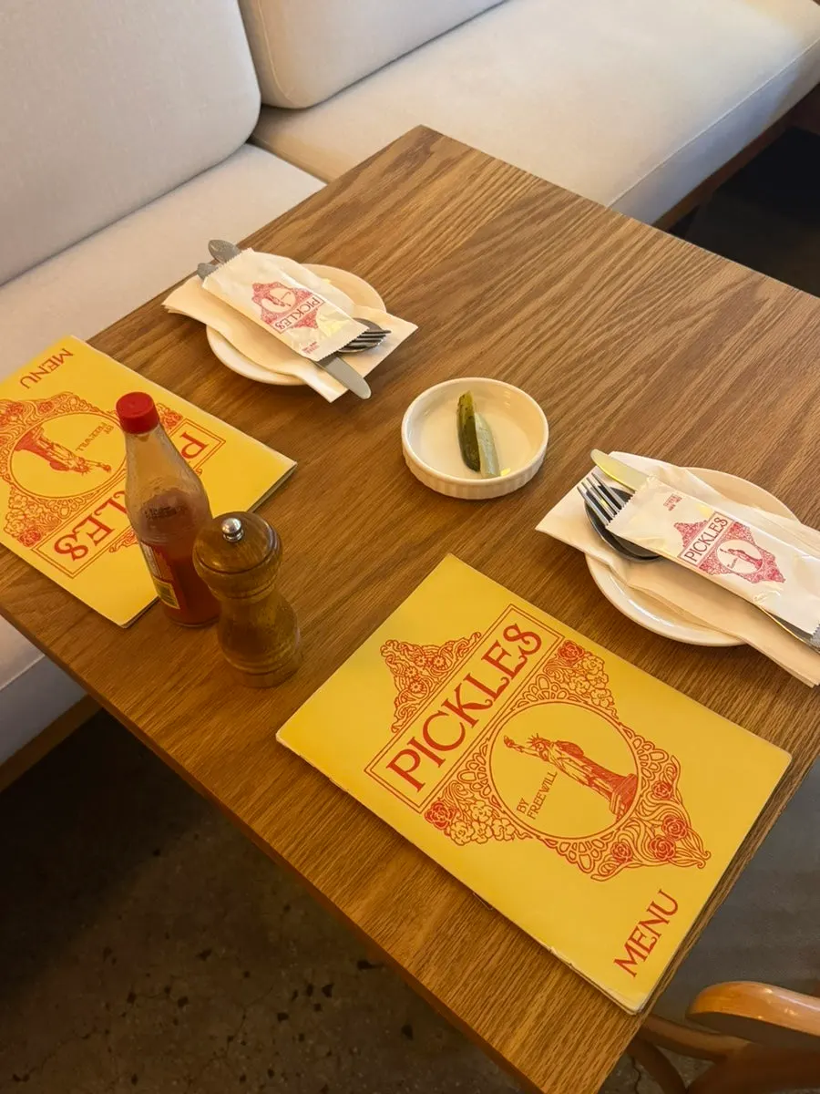 Table at Pickles set with cutlery and wet wipes