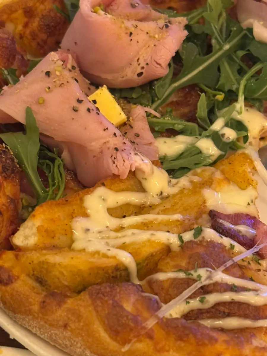 Potato pizza topped with large potato chunks