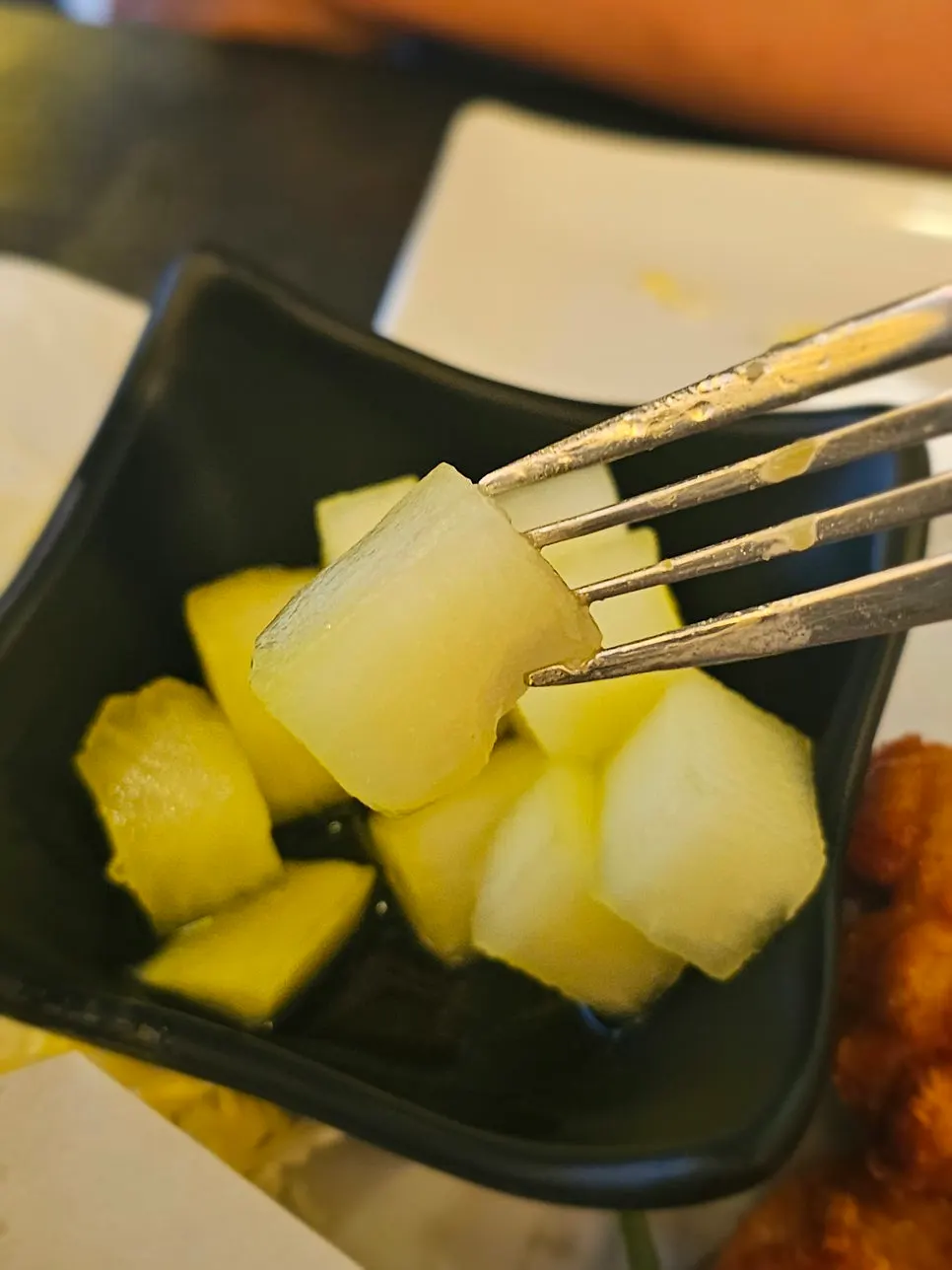 Pickled radish and cabbage salad served alongside