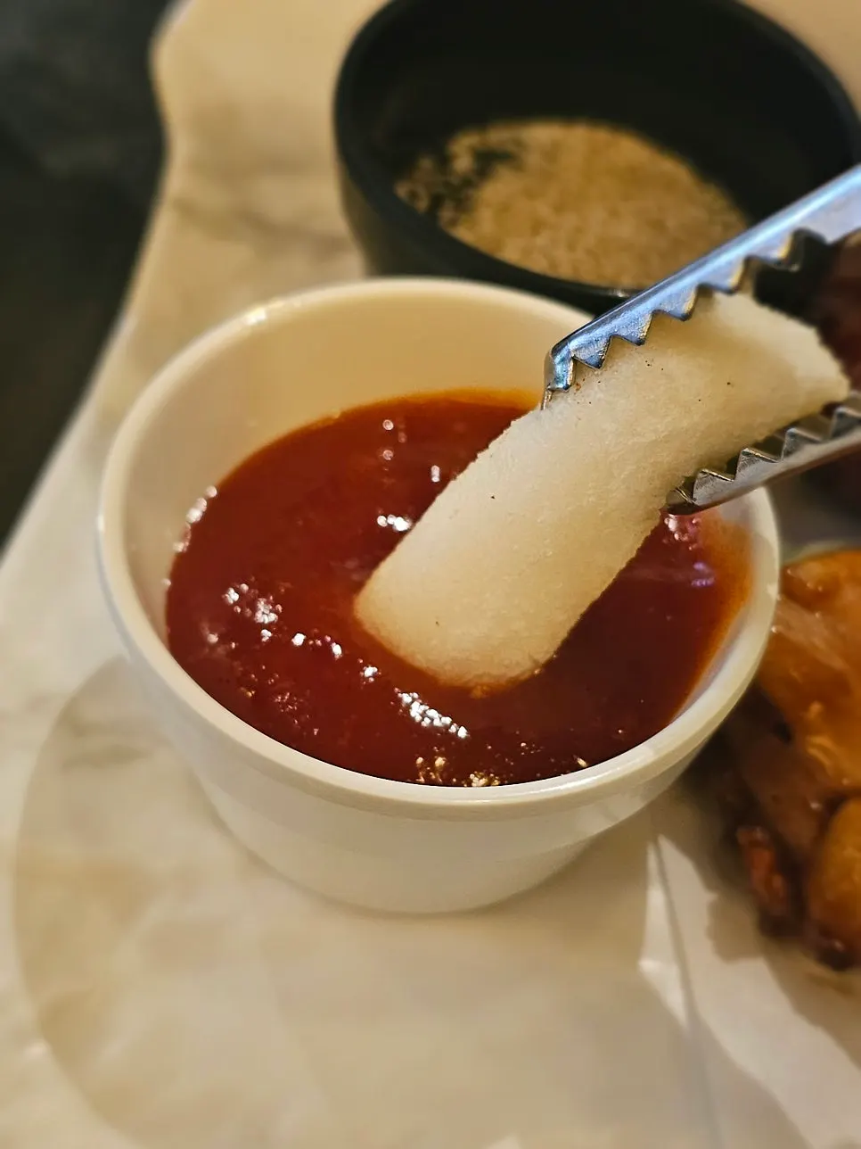 Rice cake dipped in seasoned sauce