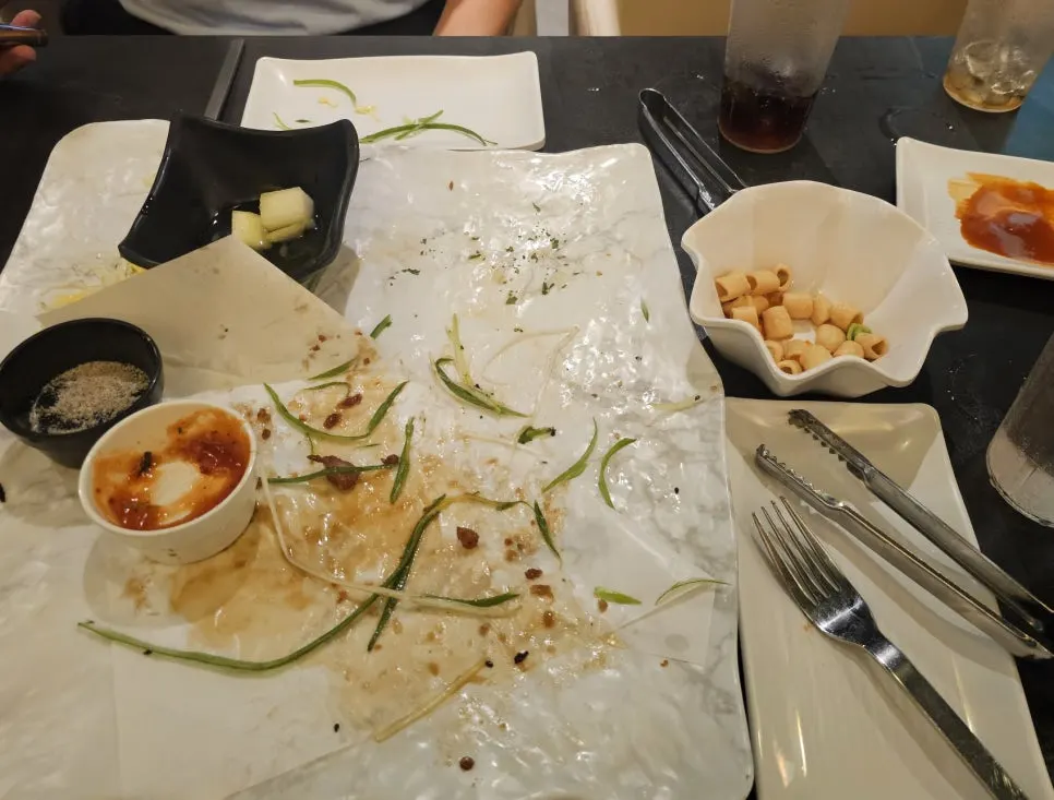 The empty plate after the couple finished their chicken