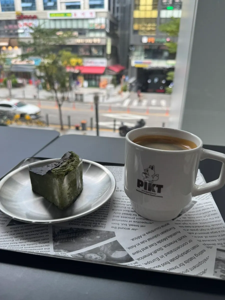Drink and dessert set at the window seat