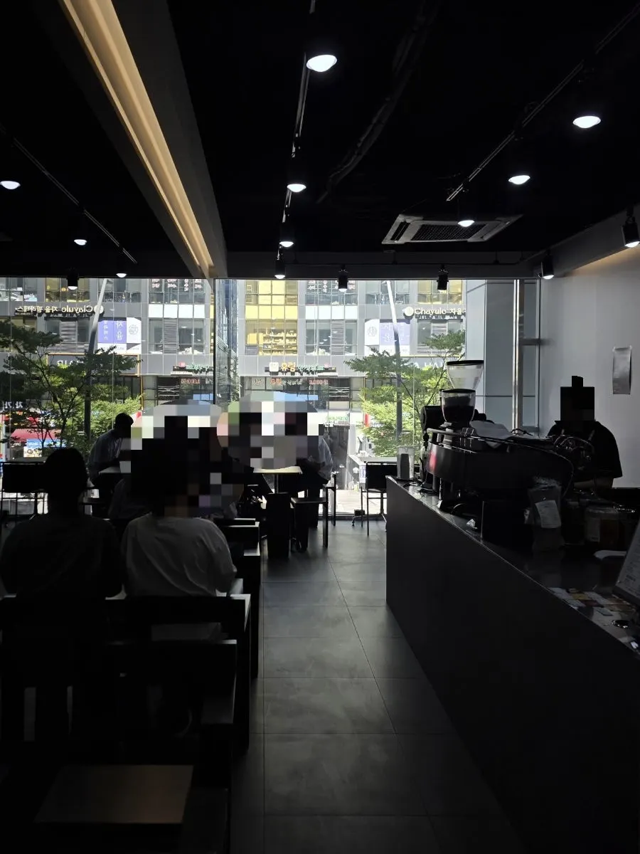 Interior of Pict Roastery with sunlight streaming through the floor-to-ceiling windows