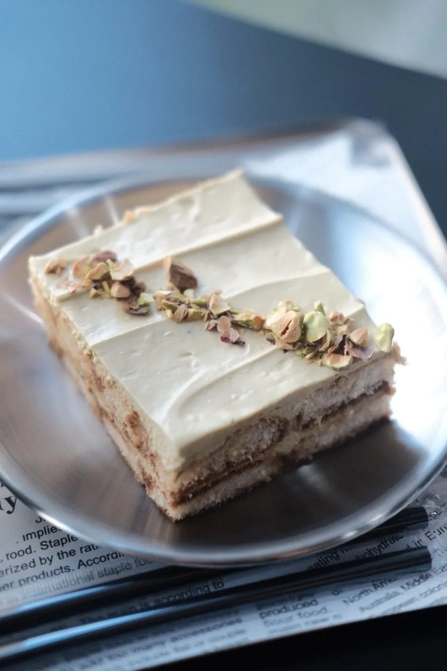 Top of the tiramisu dusted with pistachio powder